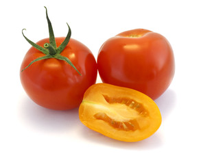 Red and yellow tomatoes on white background