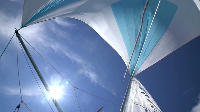 The wind blew up spinnaker at the bow of yacht