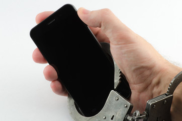 Hands cuffed phone