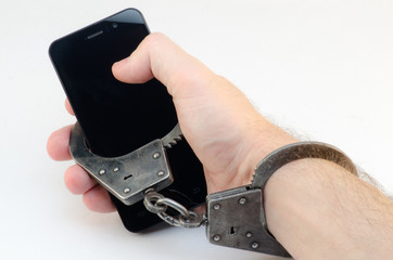 Hands cuffed phone