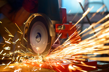Elactric Grinder Cutting Metal with Bright Sparks