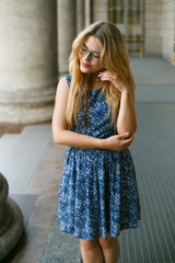Naklejka premium Fashion photo of beautiful young woman wearing lace dress, relaxing and smiling