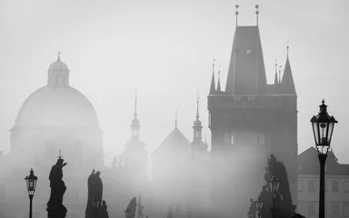 Papier Peint photo Lavable Prague Detail of the Charles Bridge with statues and tower covered by mist.