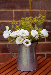Floral arrangement of white prairie gentians in a vintage jug