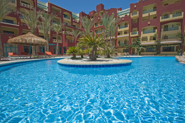 Swimming pool in luxury tropical hotel resort