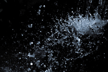 Fototapeta na wymiar Water splash on black background