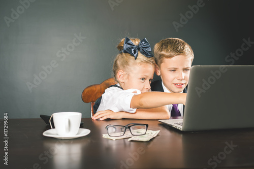 Business or school kids uses a laptop computer