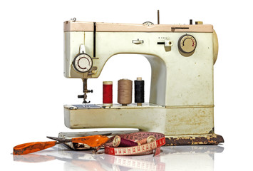 Old Rusty Vintage Sewing Machine with Scissors and Tape Measure