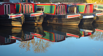 Narrow boats moored at Wrenbury on the Llangollen canal, boats and reflections © harlequin9