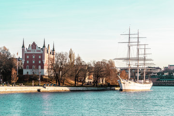 Fototapeta premium Red Castle and a Boat in Stockholm, Sweden
