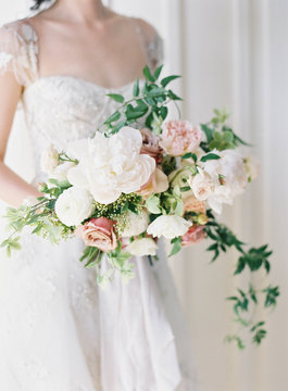 White bouquet held by bride