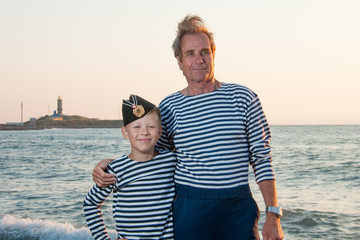 near the sea with her grandson Grandfather