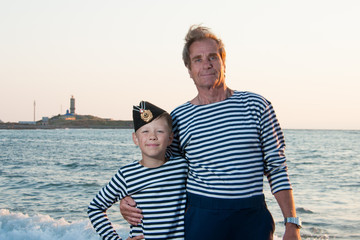 near the sea with her grandson Grandfather