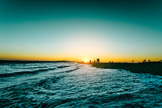 Sea surf at sunset
