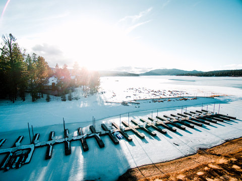 Frozen lake with boat moorings