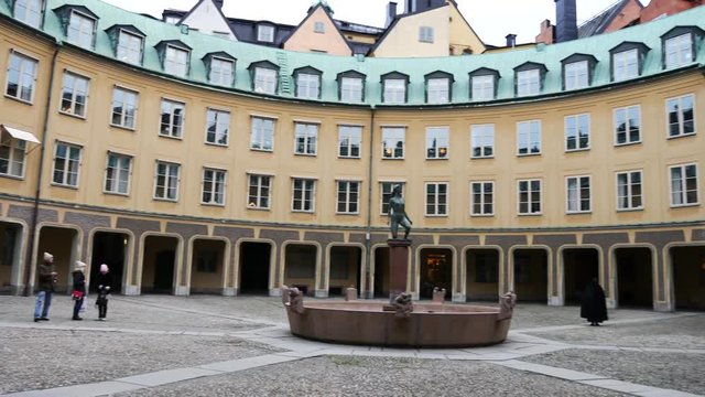 Brantingtorget public square surrounded with the building of Annex of the Chancellery and fountain in the middle, Stockholm. Panning from left to right
