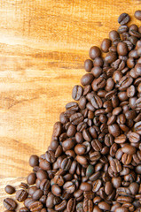 Coffee beans wooden background