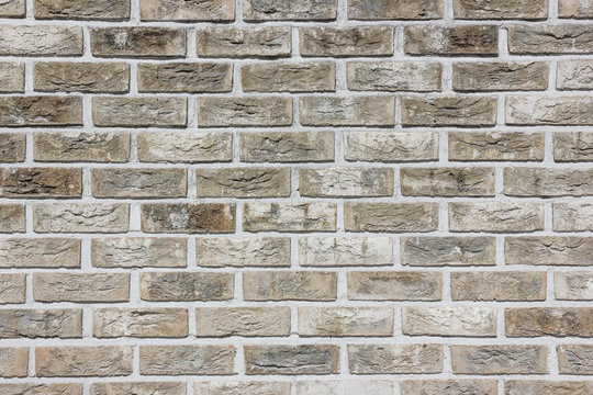 Grunge gray brick wall background.