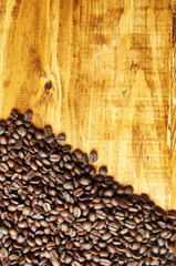 Coffee beans wooden background