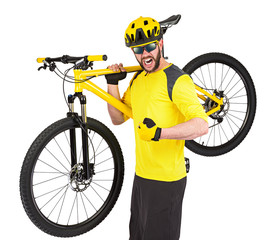 Mountainbiker / cyclist with yellow bike on shoulders / Mountainbiker Radfahrer Radsportler mit...