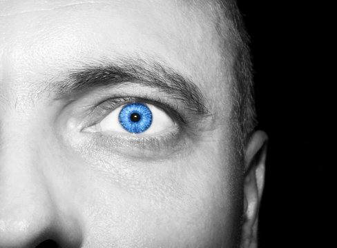 Image of man's blue eye close up.