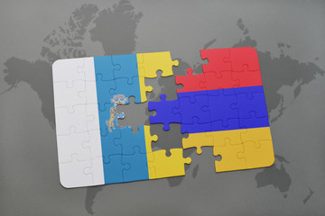 puzzle with the national flag of canary islands and armenia on a world map background.