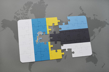 puzzle with the national flag of canary islands and estonia on a world map background.