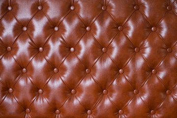 Vintage cobalt green leather upholstery buttoned sofa (background)