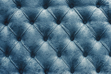 Fototapeta premium Vintage cobalt green leather upholstery buttoned sofa (background)