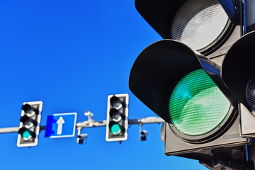 Traffic lights over blue sky
