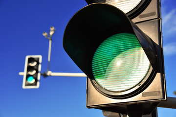 Traffic lights over blue sky