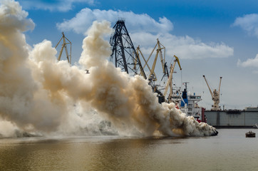 Sailboat burning in the sea © kulkann