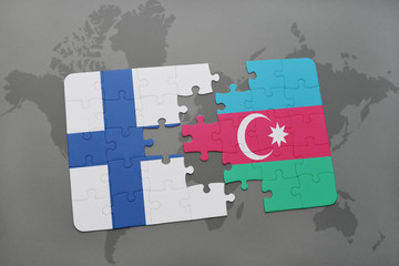 puzzle with the national flag of finland and azerbaijan on a world map background.