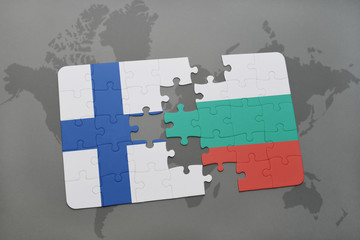 puzzle with the national flag of finland and bulgaria on a world map background.