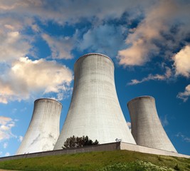 Fototapeta premium Evening colored sunset view of cooling tower