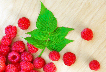 Ripe red raspberries in a bowl