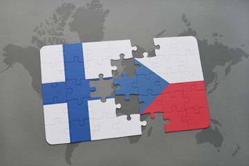 puzzle with the national flag of finland and czech republic on a world map background.