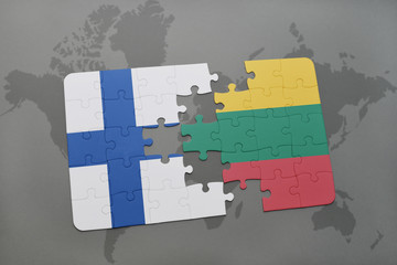 puzzle with the national flag of finland and lithuania on a world map background.