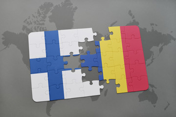 puzzle with the national flag of finland and romania on a world map background.