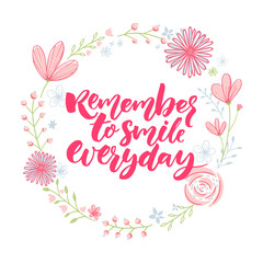 Remember to smile everyday. Inspirational saying in floral wreath. Calligraphy with flowers decorations