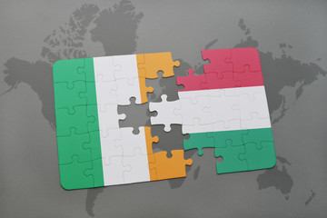 puzzle with the national flag of ireland and hungary on a world map background.