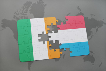 puzzle with the national flag of ireland and luxembourg on a world map background.