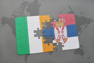 puzzle with the national flag of ireland and serbia on a world map background.