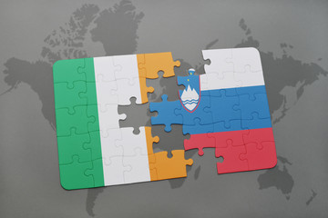 puzzle with the national flag of ireland and slovenia on a world map background.