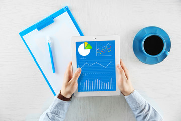 Man working with digital tablet, top view
