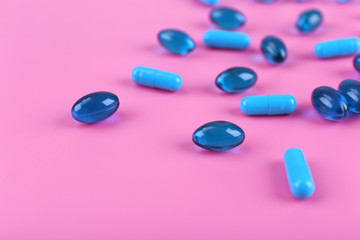 Color pills on pink background