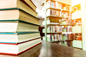 Old books on wooden table in library, education and learning con
