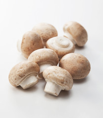 Fototapeta na wymiar fresh champignon mushrooms isolated on white