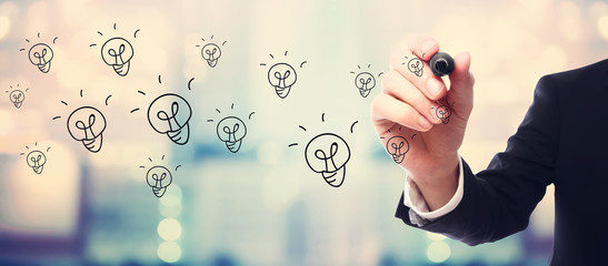 Light Bulb concept with businessman