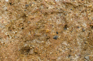 Soil erosion, rocks orange background. Caused by excavation
